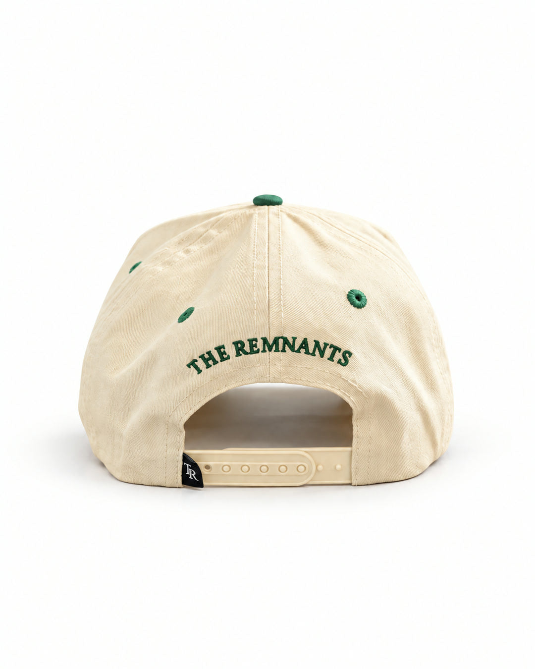 Found Cap in cream with green bill, back view with THE REMNANTS text and adjustable strap