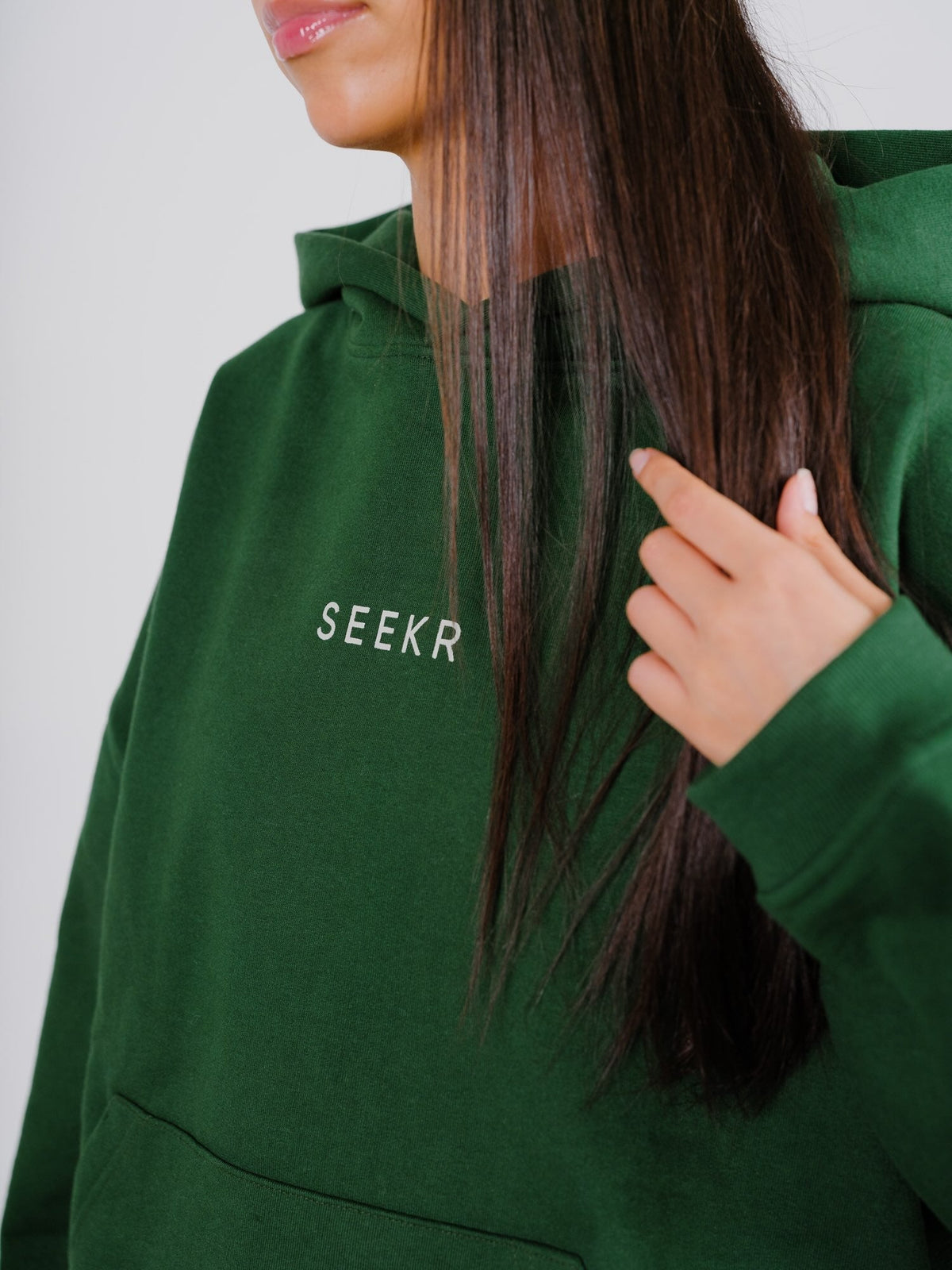 Model wearing SEEKR GREEN HOODIE