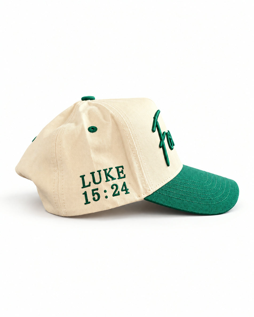 Found Cap in cream with green bill, side view showing LUKE 15:24