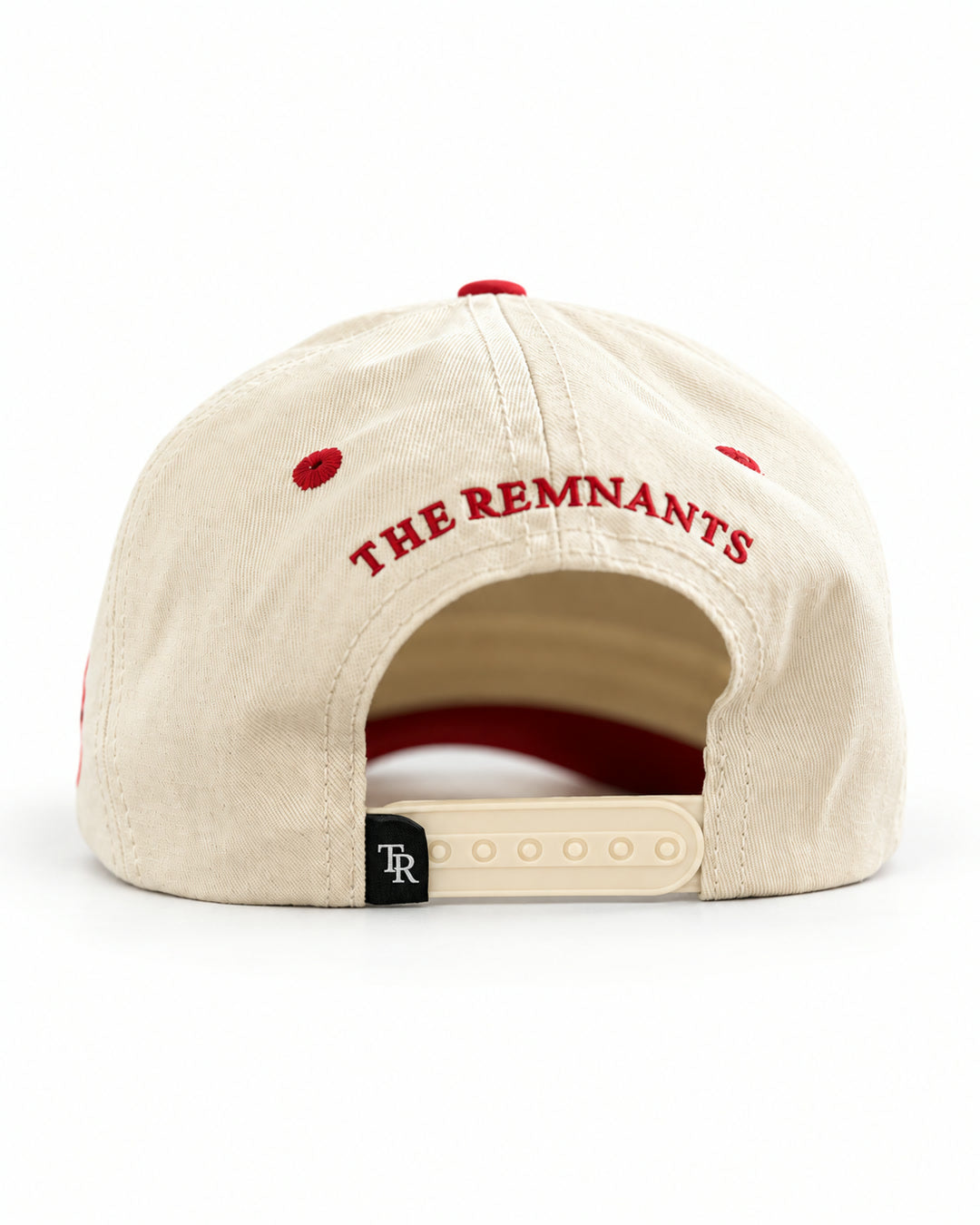 Found Cap in cream with red bill, back view with THE REMNANTS text and adjustable strap